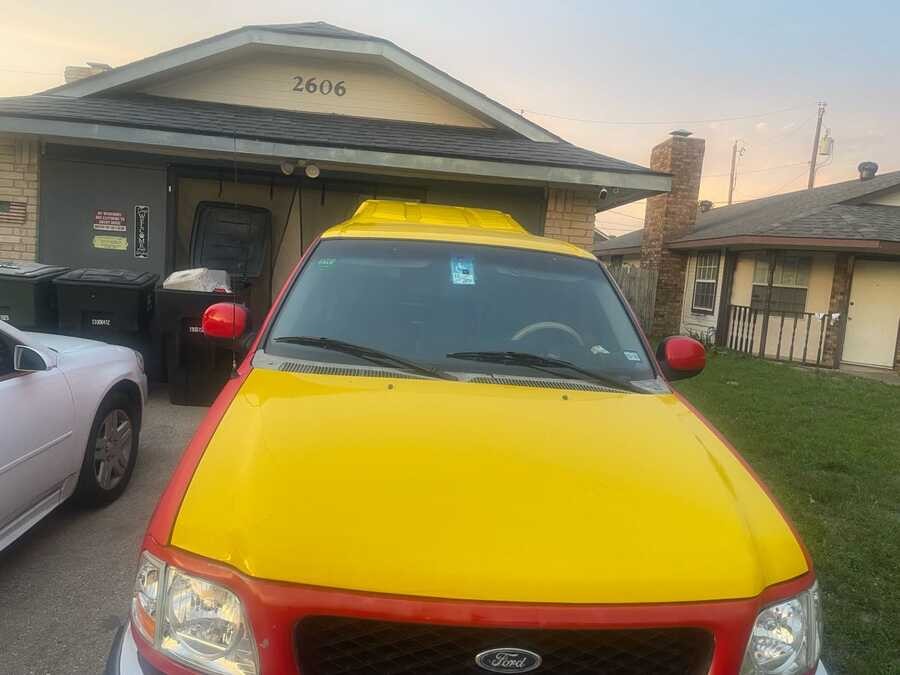 PawPaw's red and yellow mobile mechanic truck